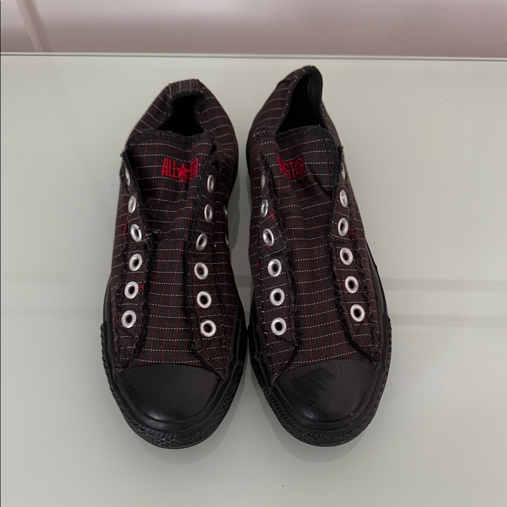 Converse Chuck Taylor slip on sneakers in a low top design with striped pattern